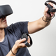 Man playing VR using a Oculus Rift.